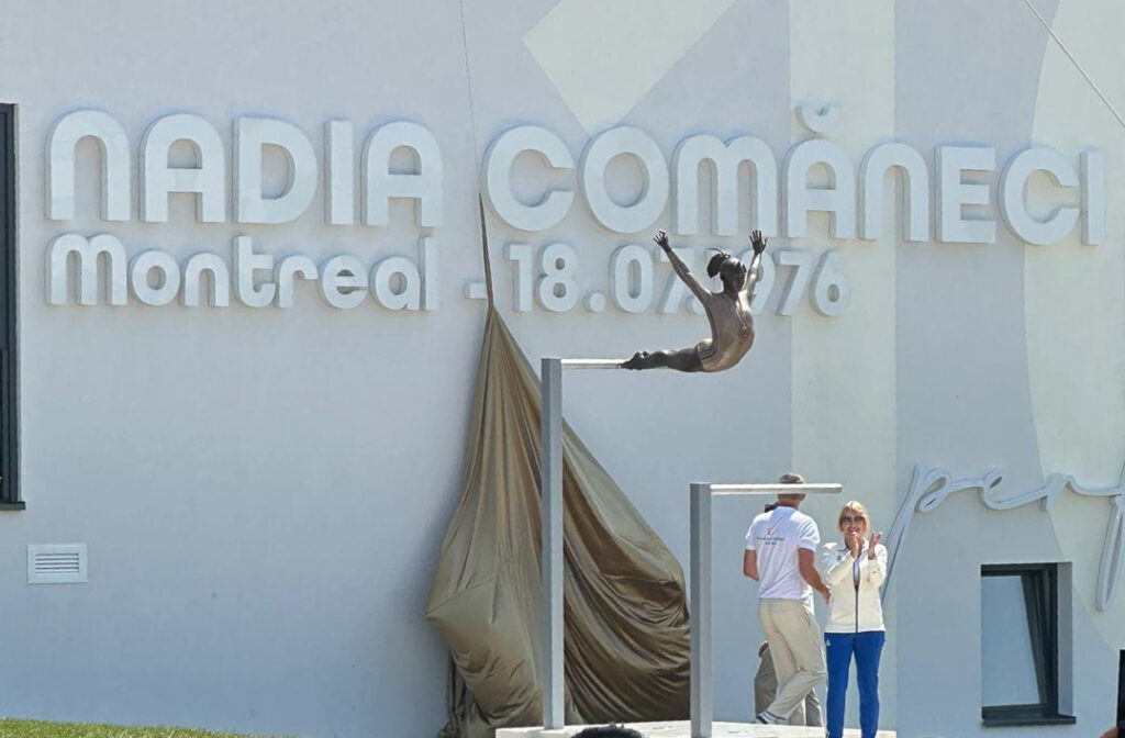 Nadia Comăneci unveils the bronze statue commemorating her 1976 Olympic perfect 10