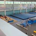 Interior of the Nadia Comăneci Gymnastics Hall training floor with Olympic-grade equipment